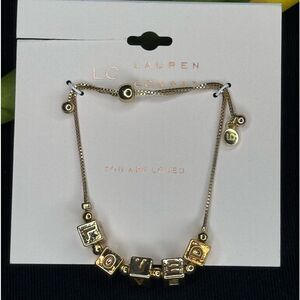 Lauren Conrad Gold Tone Beaded Bracelet with “Loved” in Gold Beads Slide Closure